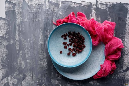 gray painted background with a beautiful spotted blue porcelain plate on top shoot with leading advertising photographer ashish gurbani based in mumbai india