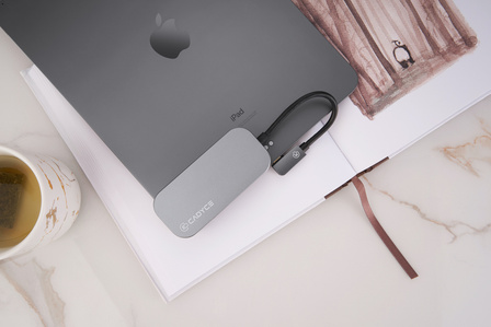an apple ipad pro-type c to usb convertor kept on a reading desk shot by the leading product photographer specializing in technology brands