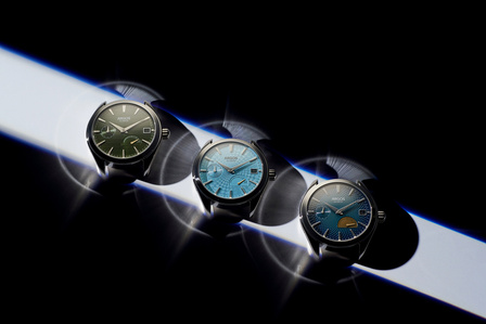 three watch cases placed on a silver background with a ray of light for product photography mumbai