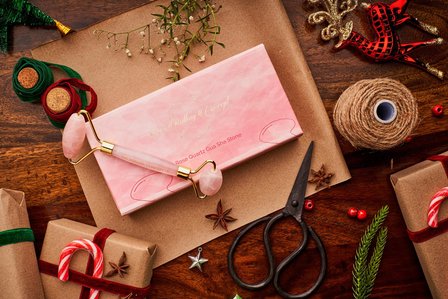 a rose quartz face roller Christmas product styling professional photoshoot for a digital branding campaign project by one of the most creative luxury product photographer ashish gurbani based in pune and mumbai india