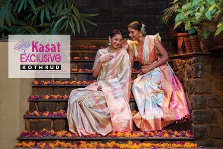 two female models sitting on a flower filled staircase sharing golden moments for a clothing brand shoot by leading indian fashion photographer based in pune india