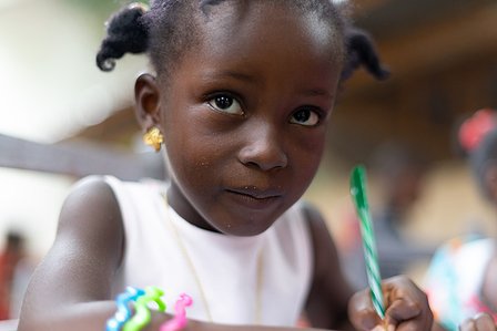 Young girl completing her homework while sitting on a desk shot by Ashish Gurbani top travel photographer based in Mumbai India.