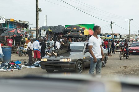 Random shot of a small village market in Monrovia from inside a car shot by Ashish Gurbani top travel photographer based in Mumbai India.