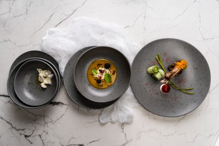 three gray plates with colour pop food styling photoshoot by top product photographer in mumbai studio india