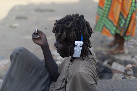 Random shot of a beggar with a phone stuck in his hair shot by Ashish Gurbani top advertising photographer based in Mumbai India.