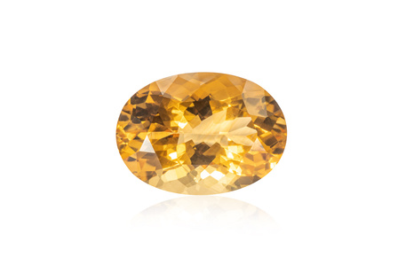 Precious yellow colored gemstone with white background, product photography by top jewellery photographer Ashish Gurbani based in Mumbai India.