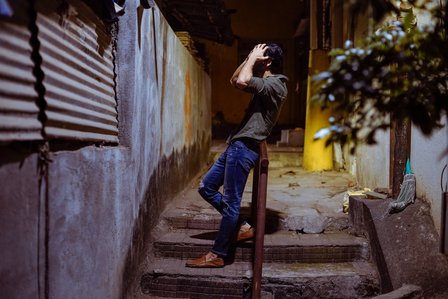 a fashion model posing in tiny indian lanes of bandra mumbai shooting with leading garment photographer ashish gurbani based in mumbai india