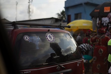 Nissan Sunny with stickers of Chelsea football club in the streets of Monrovia shot by Ashish Gurbani top advertising photographer based in Mumbai India. 