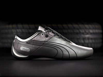 beautifully photographed gray puma future cat shoes in a studio flash lighting setup by the most creative luxury product photographer based in pune india