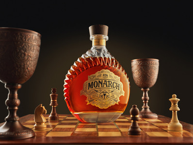 Using a bottle on a chess board by advertising commercial photographer in a studio setup for launch in india
