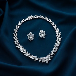 a professional concept shoot of a diamond set on blue textured background by leading creative jewellery photographer ashish gurbani based in mumbai india