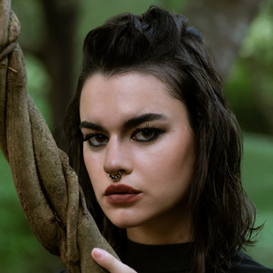 close up portrait of leading fashion model out in the jungle with the trees photoshoot by creative fashion photographer working on editorial series for magazines based in mumbai India 