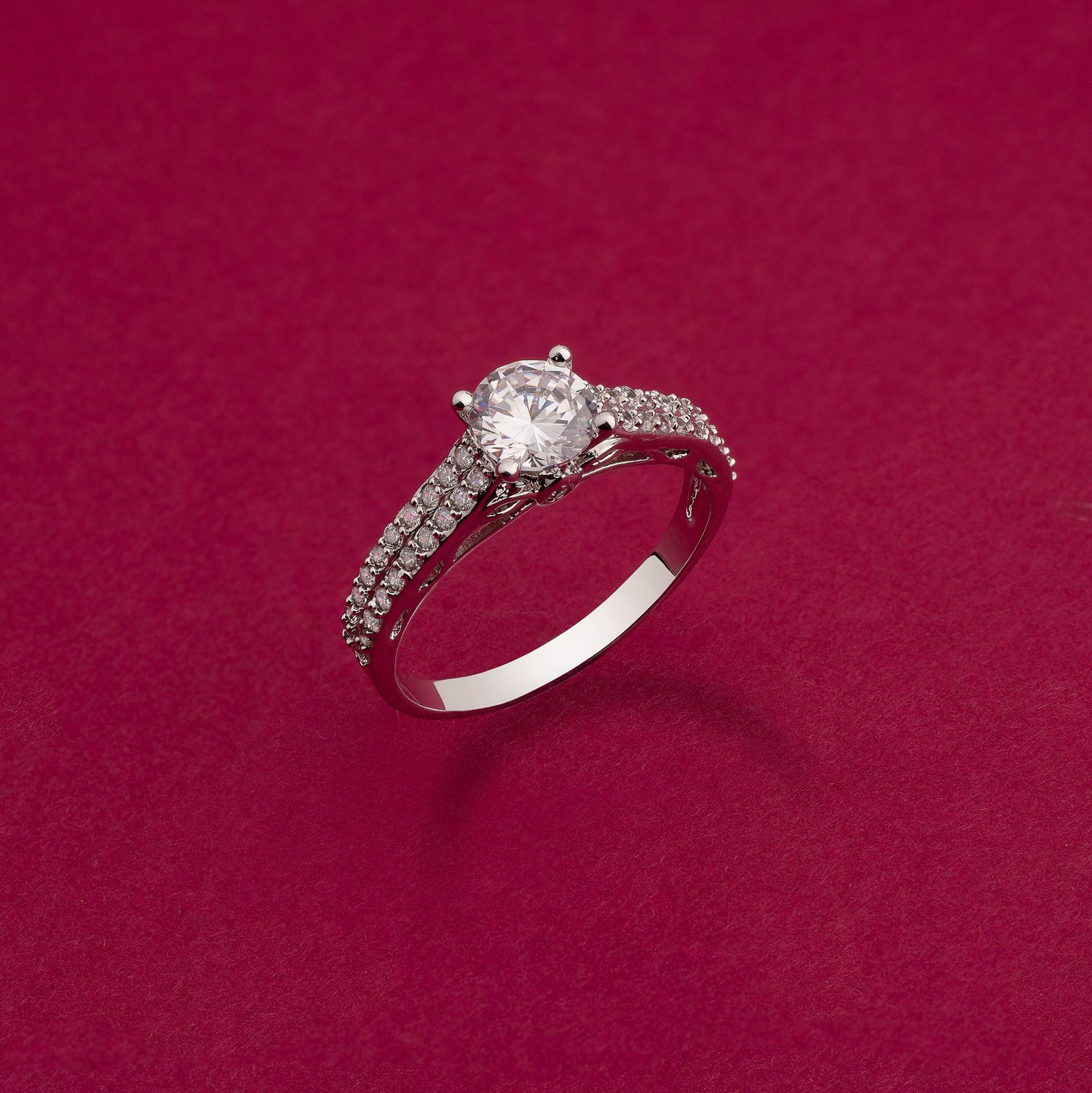an artificial solitaire diamond ring shot on a colour background using studio lighting strobes for a jewellery brand based in mumbai india brand campaign by best jewellery product photographer based in mumbai india