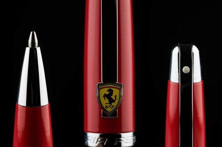 a professional ferrari scuderia macro photography shot in studio setup with black background by best advertising photographer ashish gurbani based in mumbai top luxury products photographer india