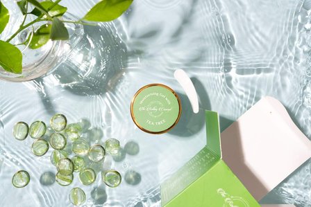 water splash concept photography with green vase and marbles for a luxury product brand advertising campaign shot by trending table top product photographer based in bangalore india