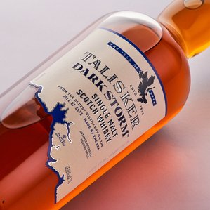 macro shot fo whiskey bottle label photographed on a white background in studio setup by top luxury product photographer for branding