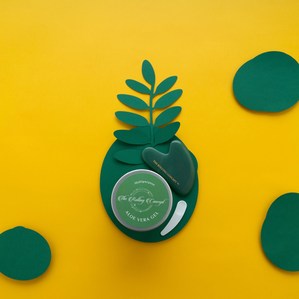 green concept plant based aloe vera gel on a bright yellow background for a trending new cosmetic brand photographed by leading skin care product photographer based in delhi india