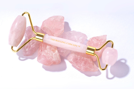 rose quartz roller styling with raw unpolished stones photoshoot in harsh sunlight highkey product shot by leading still life photographer for skincare brands ashish gurbani based in mumbai and pune india