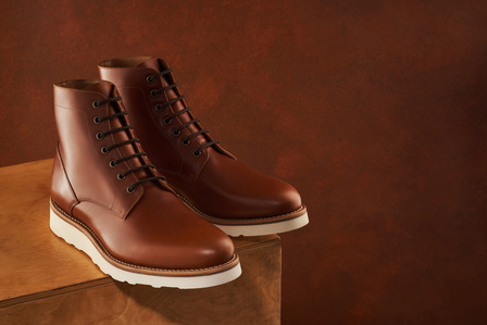 brown leather shoes photographed on a wooden box by best conceptual shoe photographer in pune india