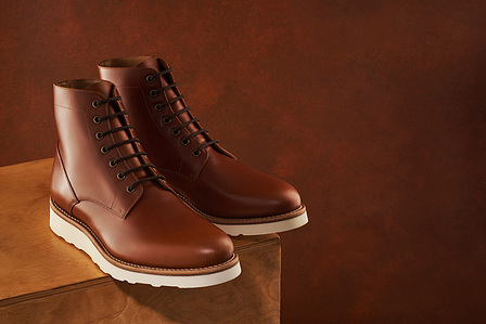 brown leather shoes photographed on a wooden box by best conceptual shoe photographer in pune india