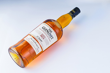 ecommerce shoot of a beautiful glen livet single malt whiskey shot on a white background in a studio setup by one of the best luxury prodcut photographers based in india mumbai