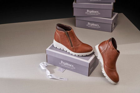 ecommerce product photograpy in india for brown boots in studio
