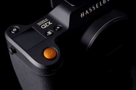 close up orange button of Hasselblad camera shot by a leading still life photographer based in Pune india