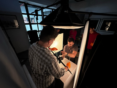 a moment of focus where the product stylist and photographer set up a tech product photographer for product shoot in pune India
