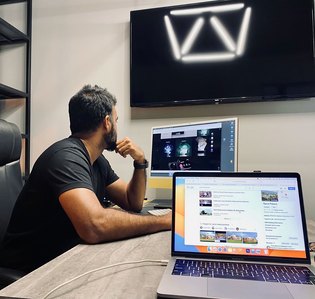 sitting in the studio with best product photographer brainstorming for upcoming brand photoshoot in Pune India 