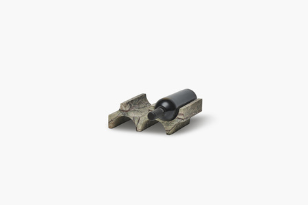 a stone wine bottle holder shot in a studio setup on a white background by leading product photographer based in pune