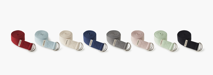 a collection of different colours yoga belts branded and designed by best advertising photographer based in pune