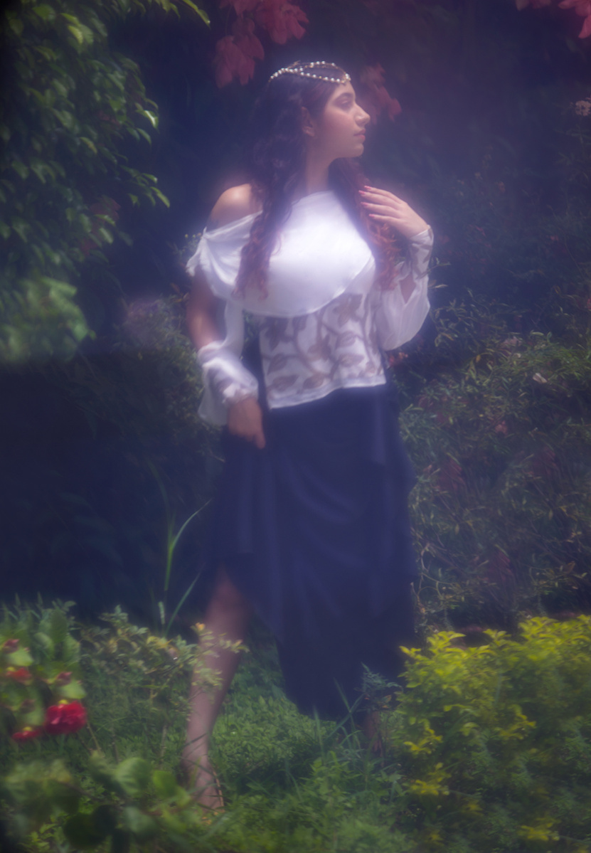 female model standing in nature wearing designer clothing for leading editorial photographer based in mumbai india