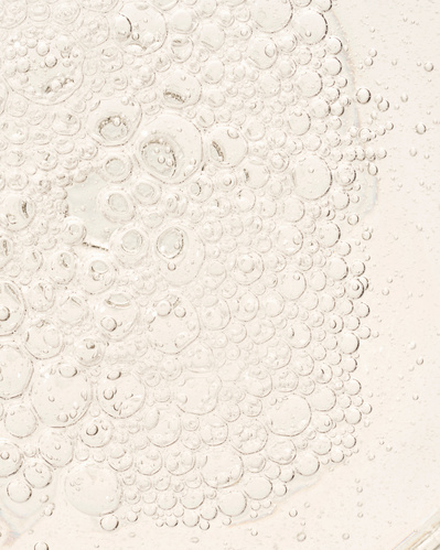 Closeup image of champagne bubbles.