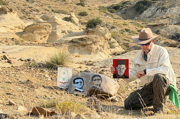 Craig kneeling by Roy Orbison Rock, in Casper, Wyoming. Seth painted the rock on 5-1-18. 