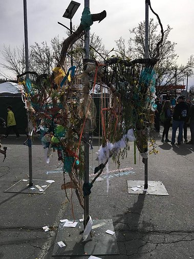 Community art installation made with recycled materials. 