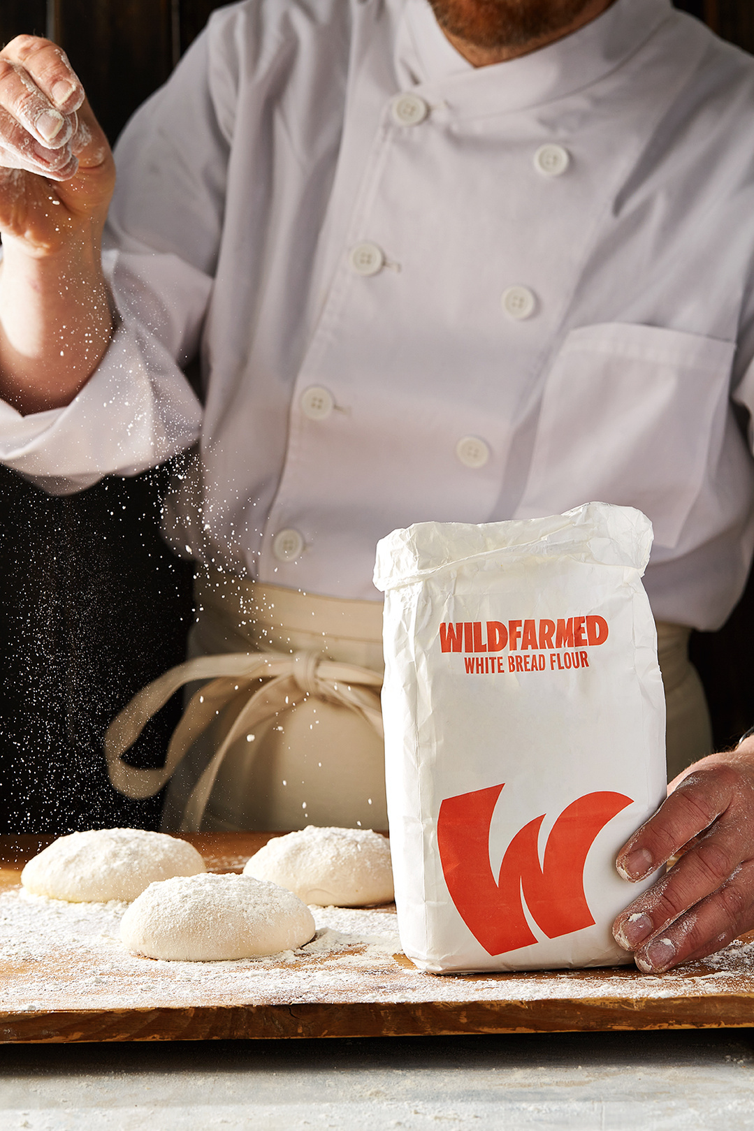 Baker preparing sourdough bread for Hilton in-house deli brand Do Deli using Wildfarmed flour. Photography by Lol Johnson. Food Prep and styling by Iona Blackshaw. Recipe development by Jane Alty.