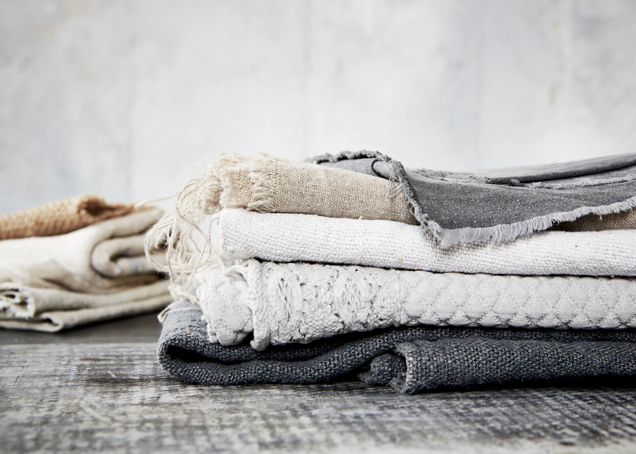 Still life imagery of frayed and worn fabric shot against a distressed wooden surface from Topham Street props house. Shot for branding agency Seeing Things Creative by London based food and tableware photographer Lol Johnson.