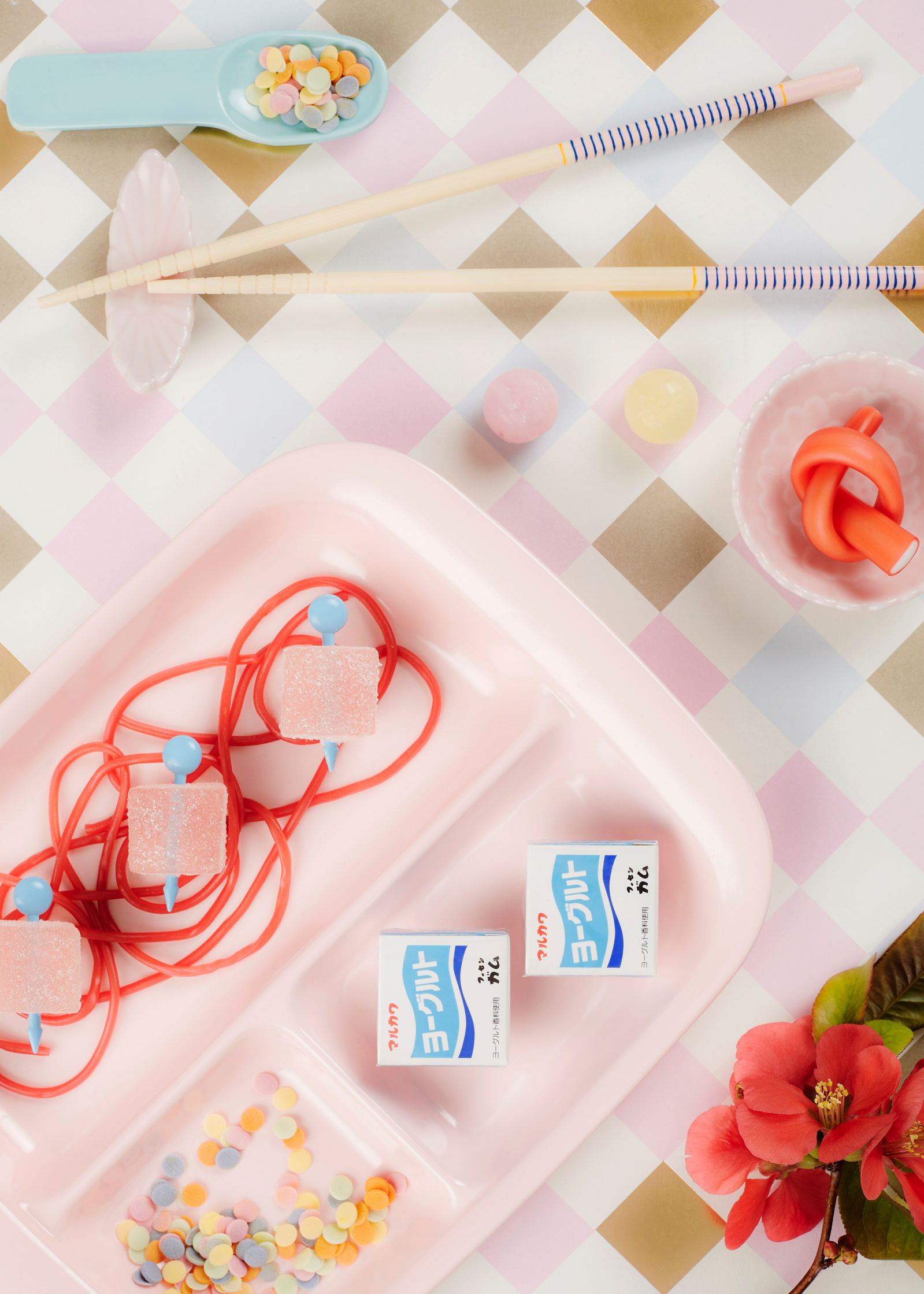 Food photographer Lol Johnson - personal project featuring a selection of thai sweets  with playful pastel backdrop and products. Styling by Liz Cooper.