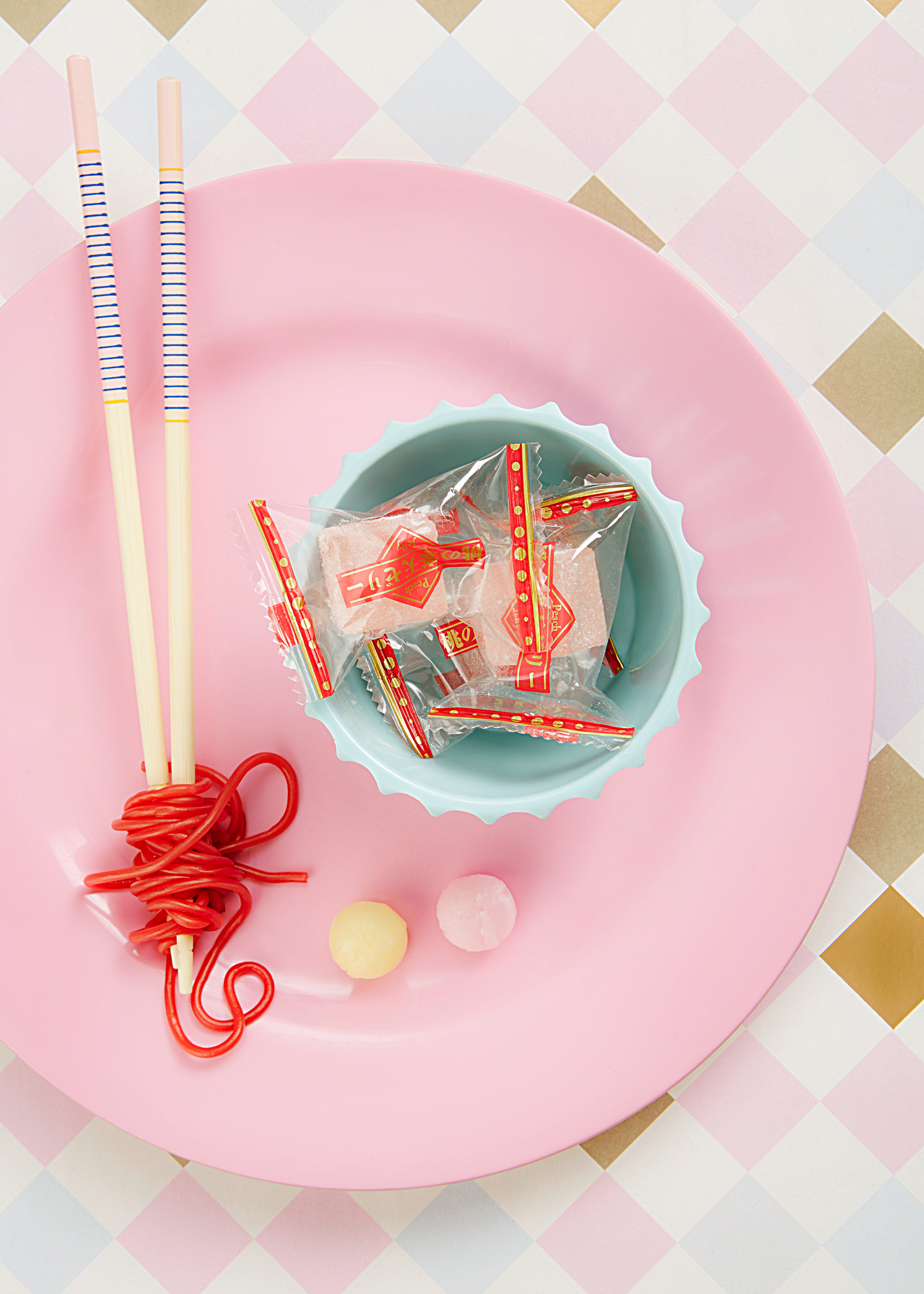 Food photographer Lol Johnson - personal project featuring a selection of thai sweets  with playful pastel backdrop and products. Styling by Liz Cooper.