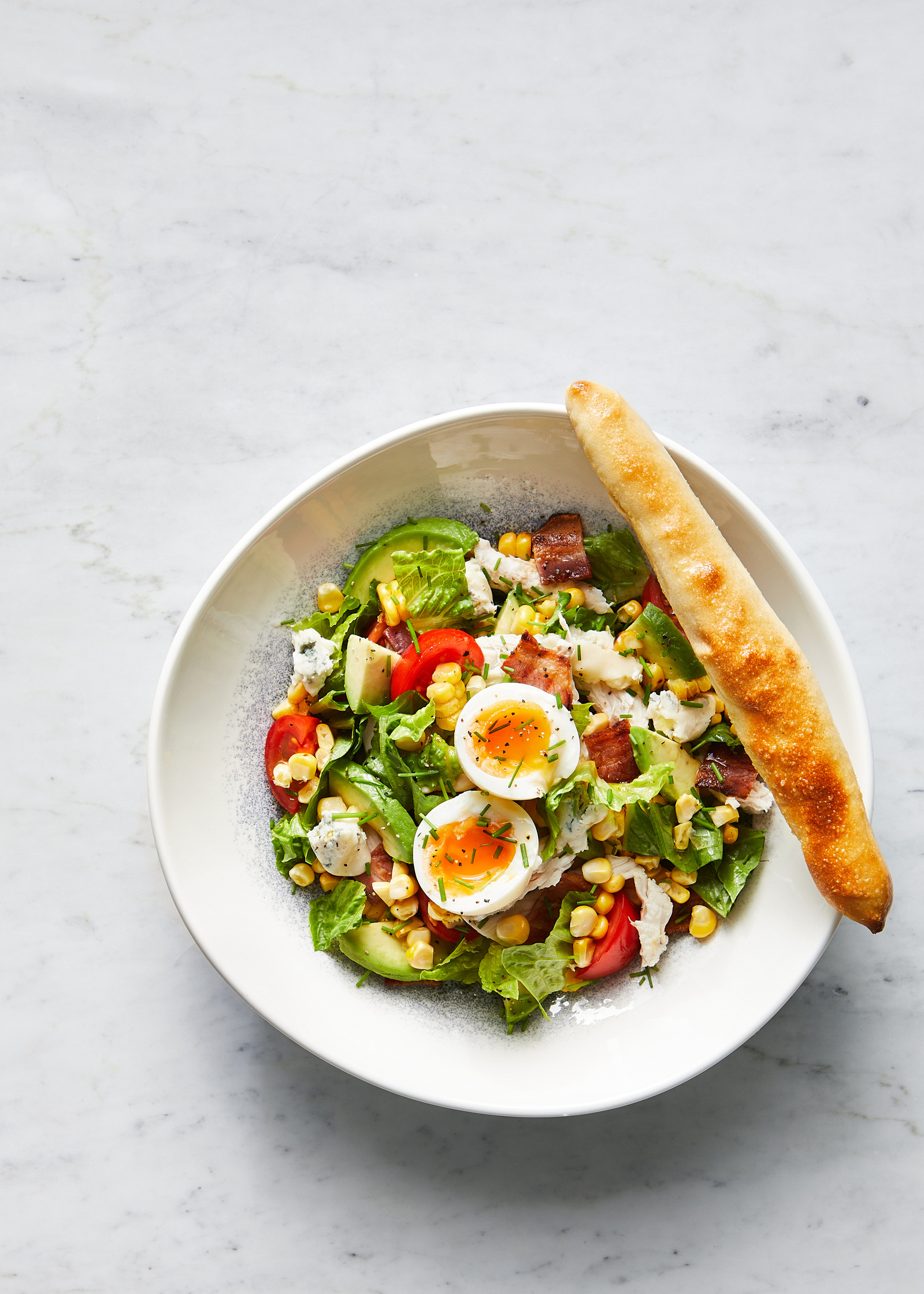 Classic Cobb salad and dough sticks by Do Deli @ Hilton. Photography by south east London based food photographer Lol Johnson. Food prep and styling by Iona Blackshaw. Recipe development by consultant chef Jane Alty.