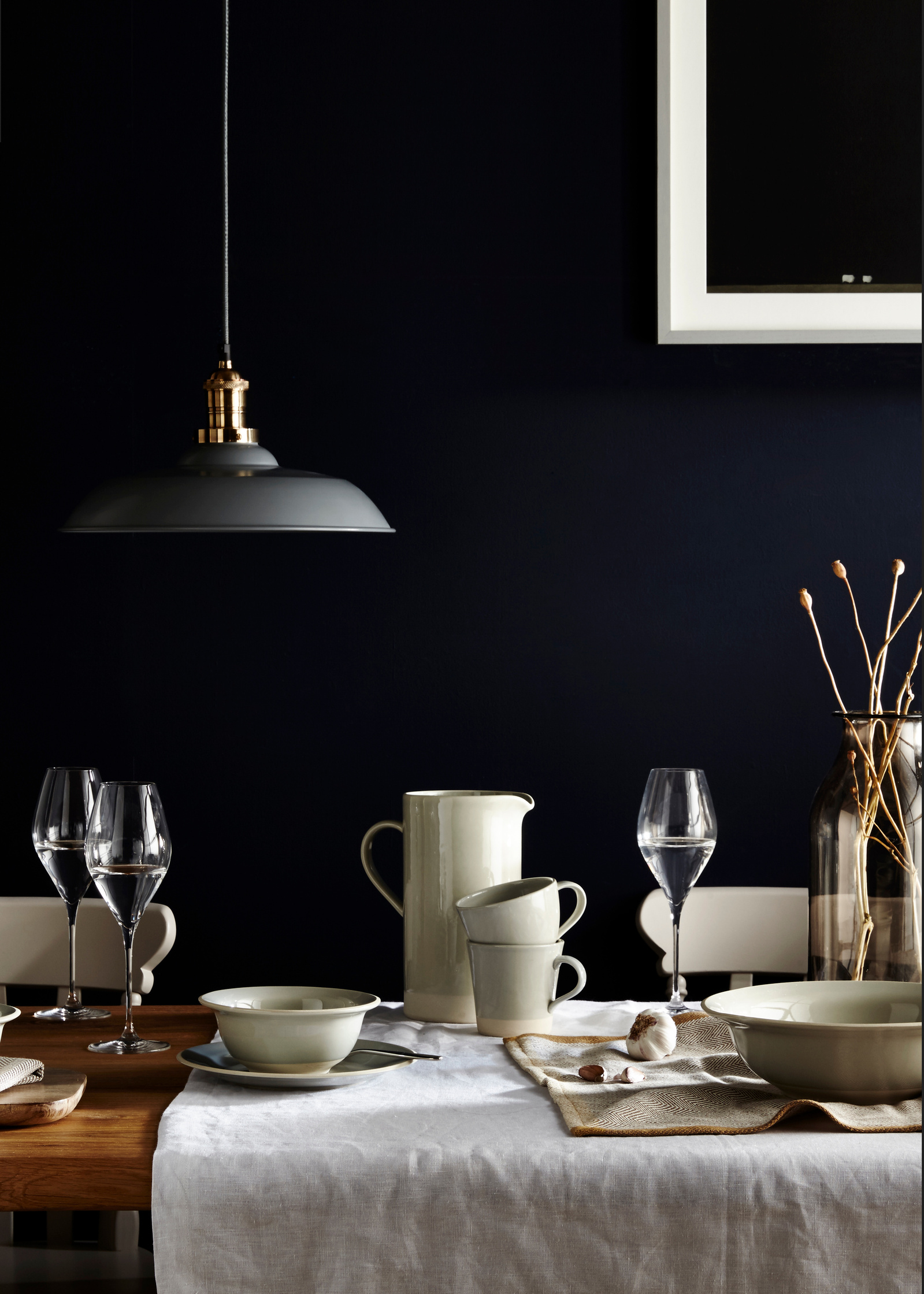 Still life product photography for John Lewis featuring items from the Croft range on a tablescape against an ink blue wall. Shot by London based food and interiors photographer Lol Johnson. Styling by Claire Piper.