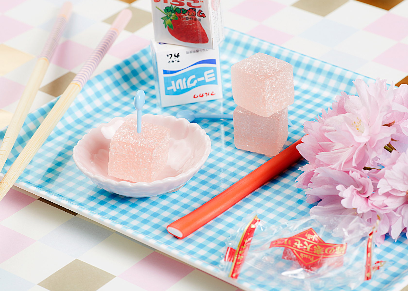 Food photographer Lol Johnson - personal project featuring a selection of thai sweets  with playful pastel backdrop and products. Styling by Liz Cooper.