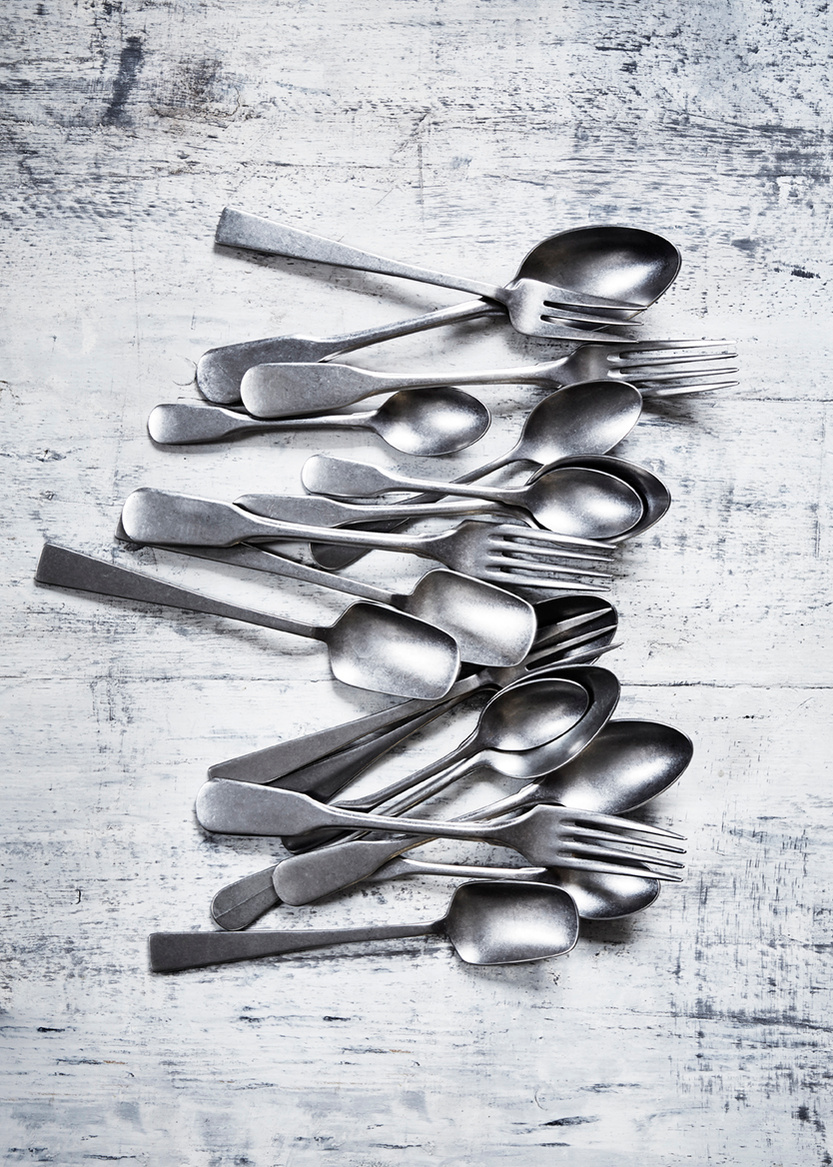 Still life imagery of tarnished classic cutlery shot against a distressed wooden surface from Topham Street props house. Shot for branding agency Seeing Things Creative by London based food and tableware photographer Lol Johnson.