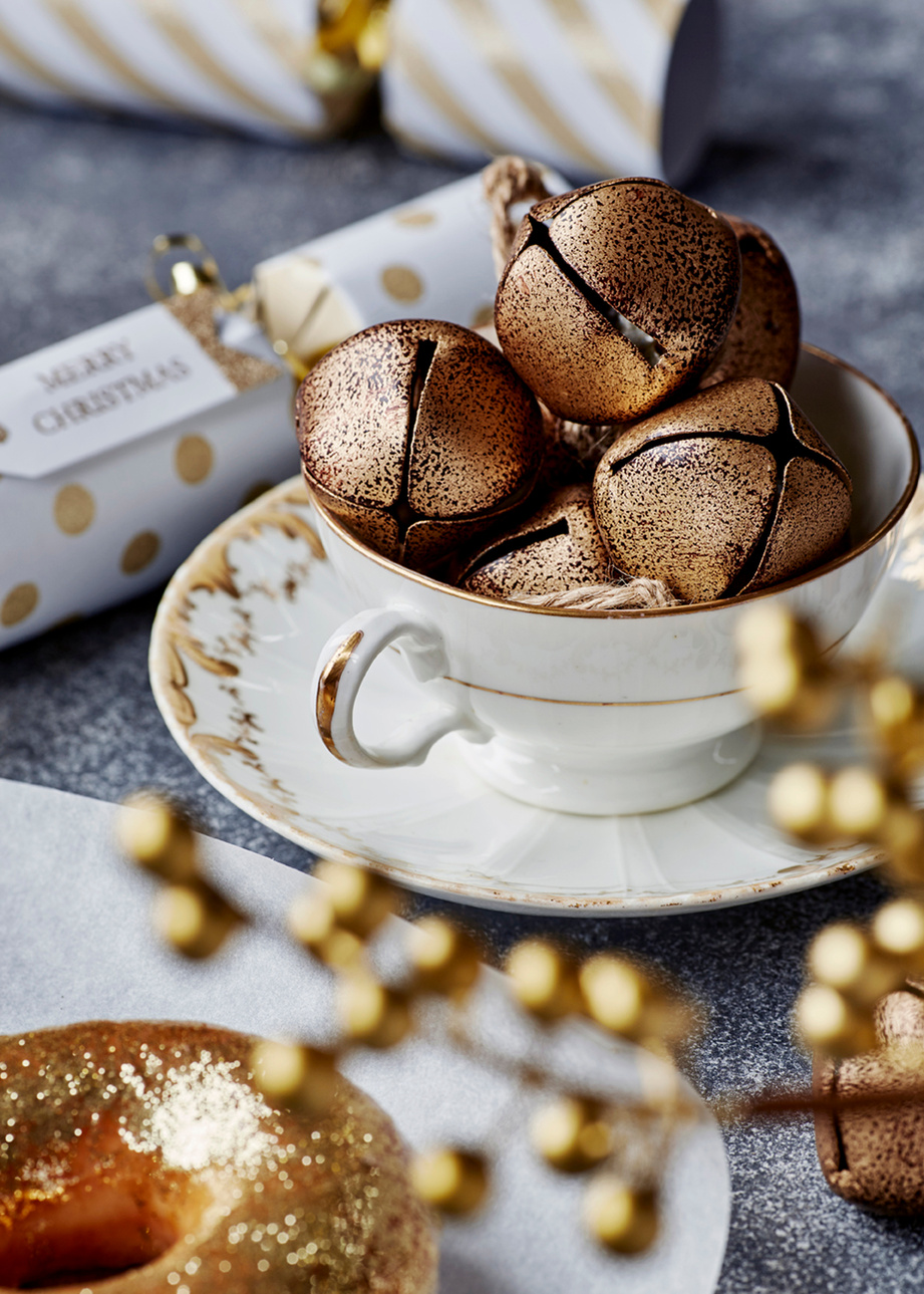 Easy ideas for food based decorating at Christmas. Gold dusted doughnuts. Shot by London based still life and food photographer Lol Johnson. Styling by Liz Cooper.