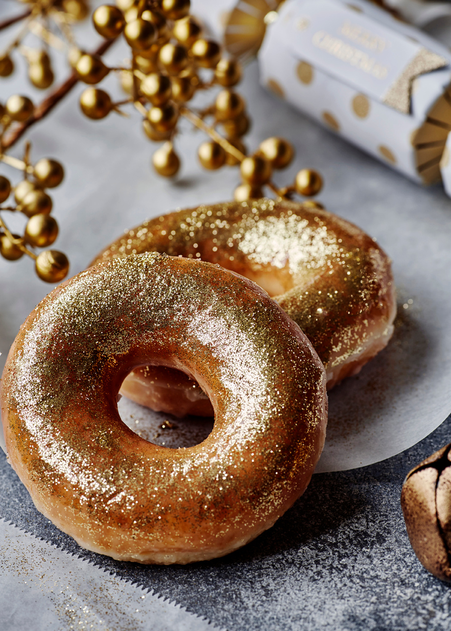 Easy ideas for food based decorating at Christmas. Gold dusted doughnuts. Shot by London based still life and food photographer Lol Johnson. Styling by Liz Cooper.