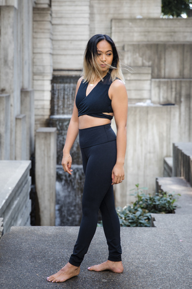 Female yoga instructor poses at Freeway Park in Seattle. 