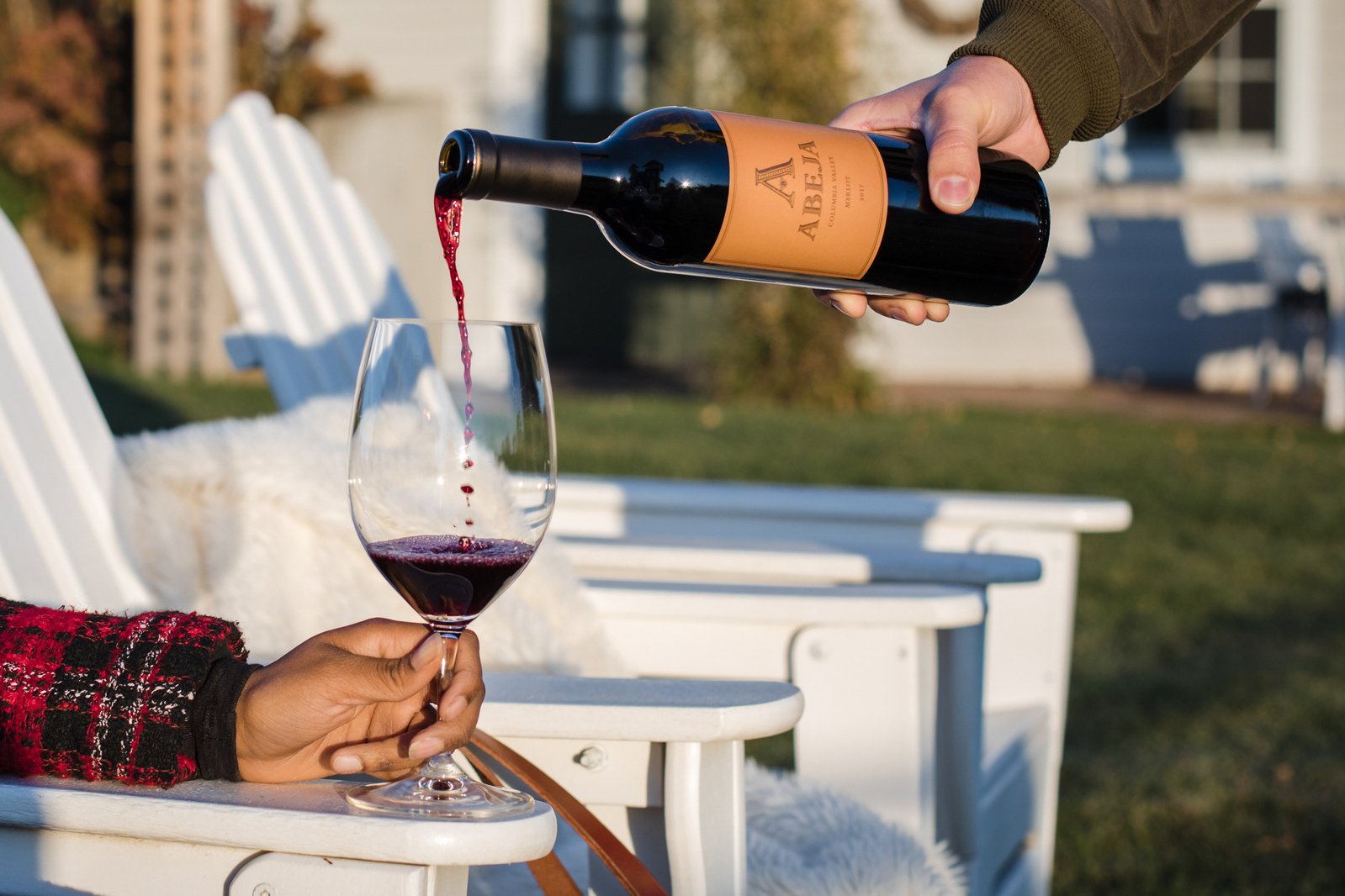 Red wine pours into a glass at a Walla Walla winery. 