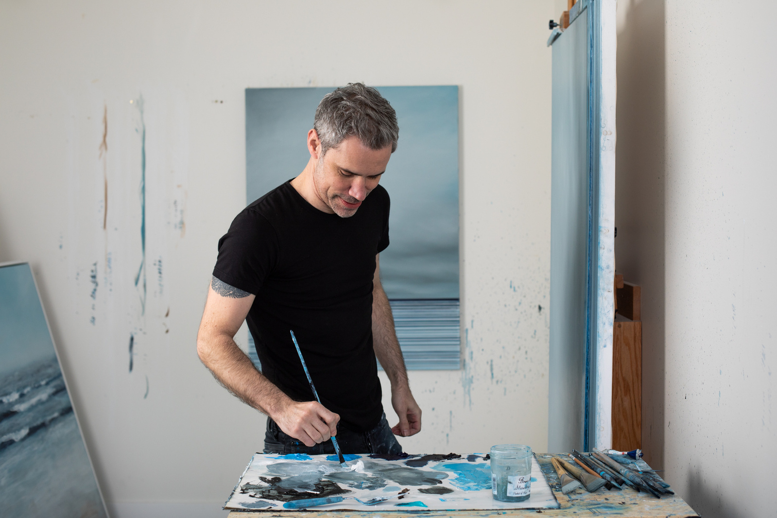 A painter at his canvas.
