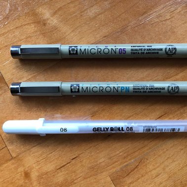 Sakura Pigma Micron pens in black #05 and PN, Sakura Gelly Roll pen in white