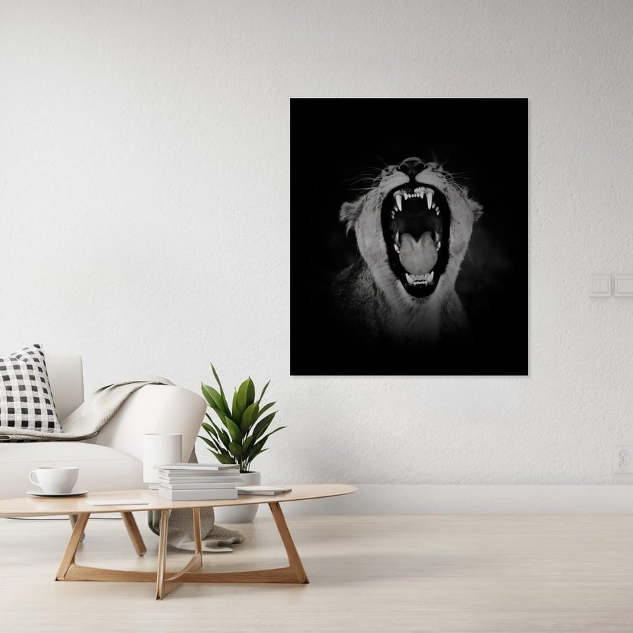 Black and white close-up portrait of a roaring lioness. Her teeth and tongue are dramatically lit, highlighting her powerful expression and primal energy. A bold wildlife photography print capturing the raw emotion and strength of a female predator.